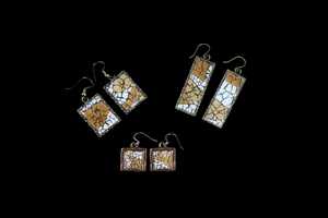 jewelry 14: These earrings are constructed with natural colored eggshells on metal bases covered with resin.