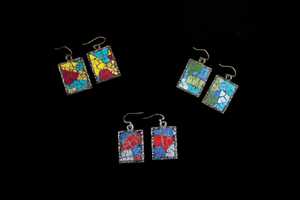 jewelry 13: These earrings are constructed with painted egg shells on metal bases covered with resin.